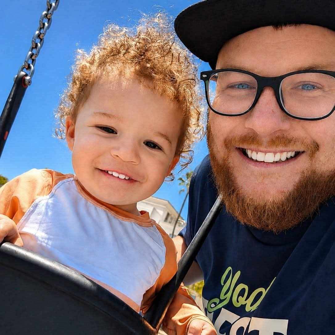 The owner of Yardsmith Solutions with his son at the park